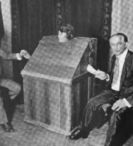 Mina Crandon being tested by Houdini